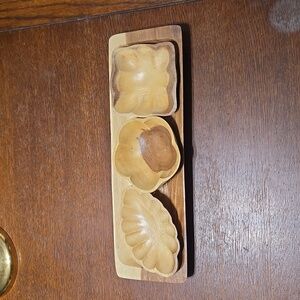 Serving tray with three dishes.